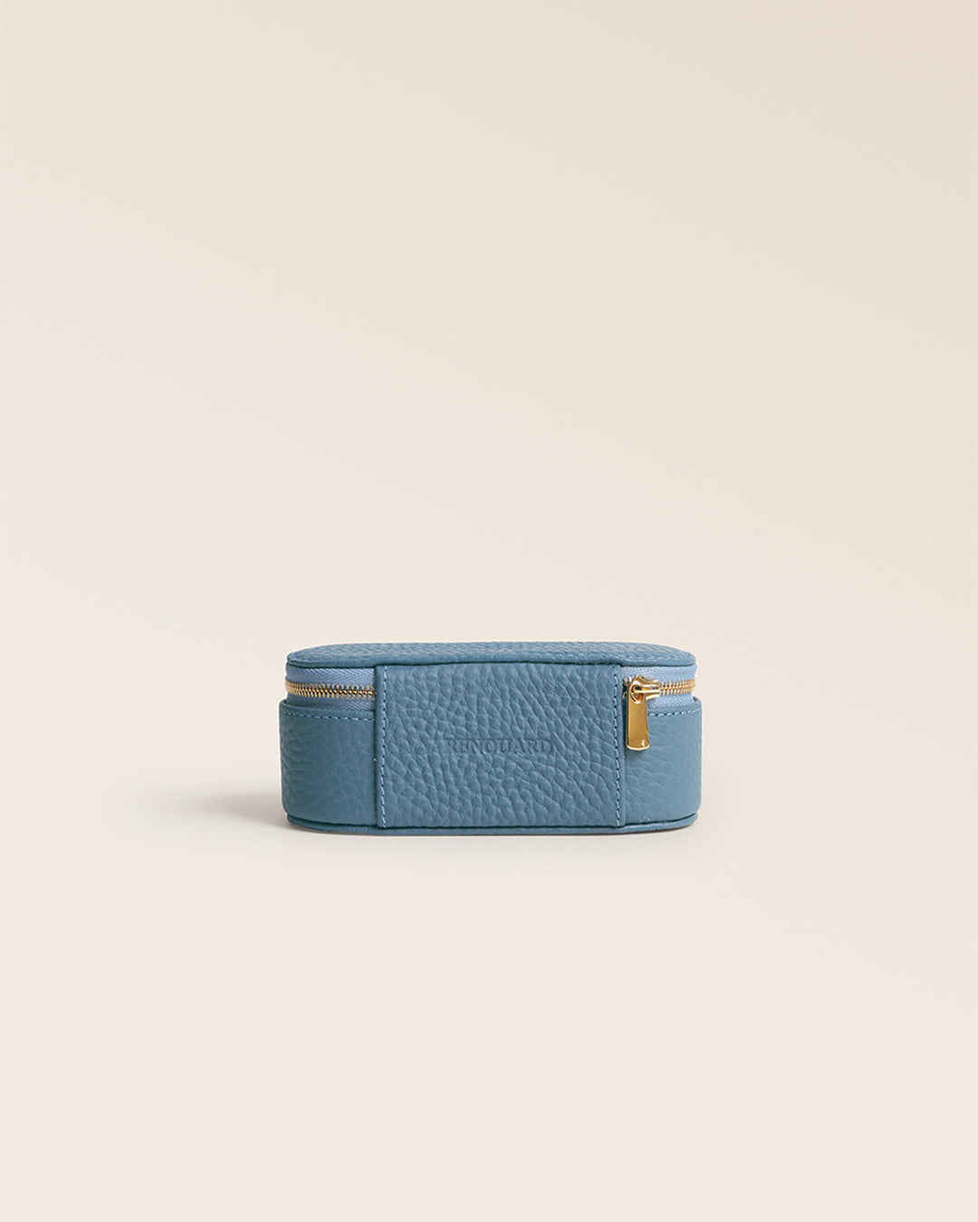 Notre boitier pour rouge à lèvres Renouard en cuir façon vigogne bleu cobalt vu de dos en studio.