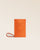 Notre pochette téléphone Étrivière en cuir façon vigogne orange vue de face en studio.
