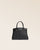 Notre sac Prestige mini modèle en cuir façon vigogne noir vu de face en studio.